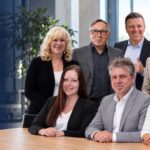 Das Team von Kämmer Consulting gemeinsam im Büro